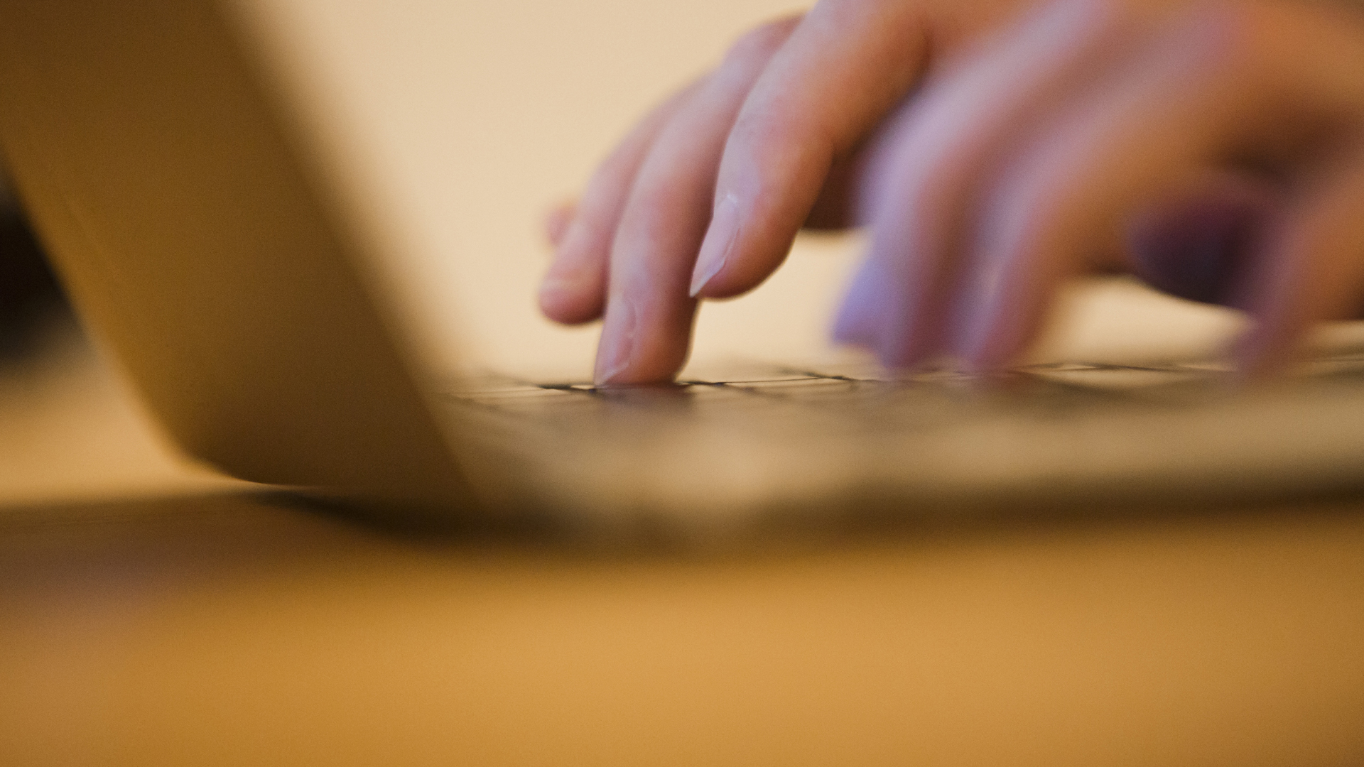 Hands on a computer keyboard