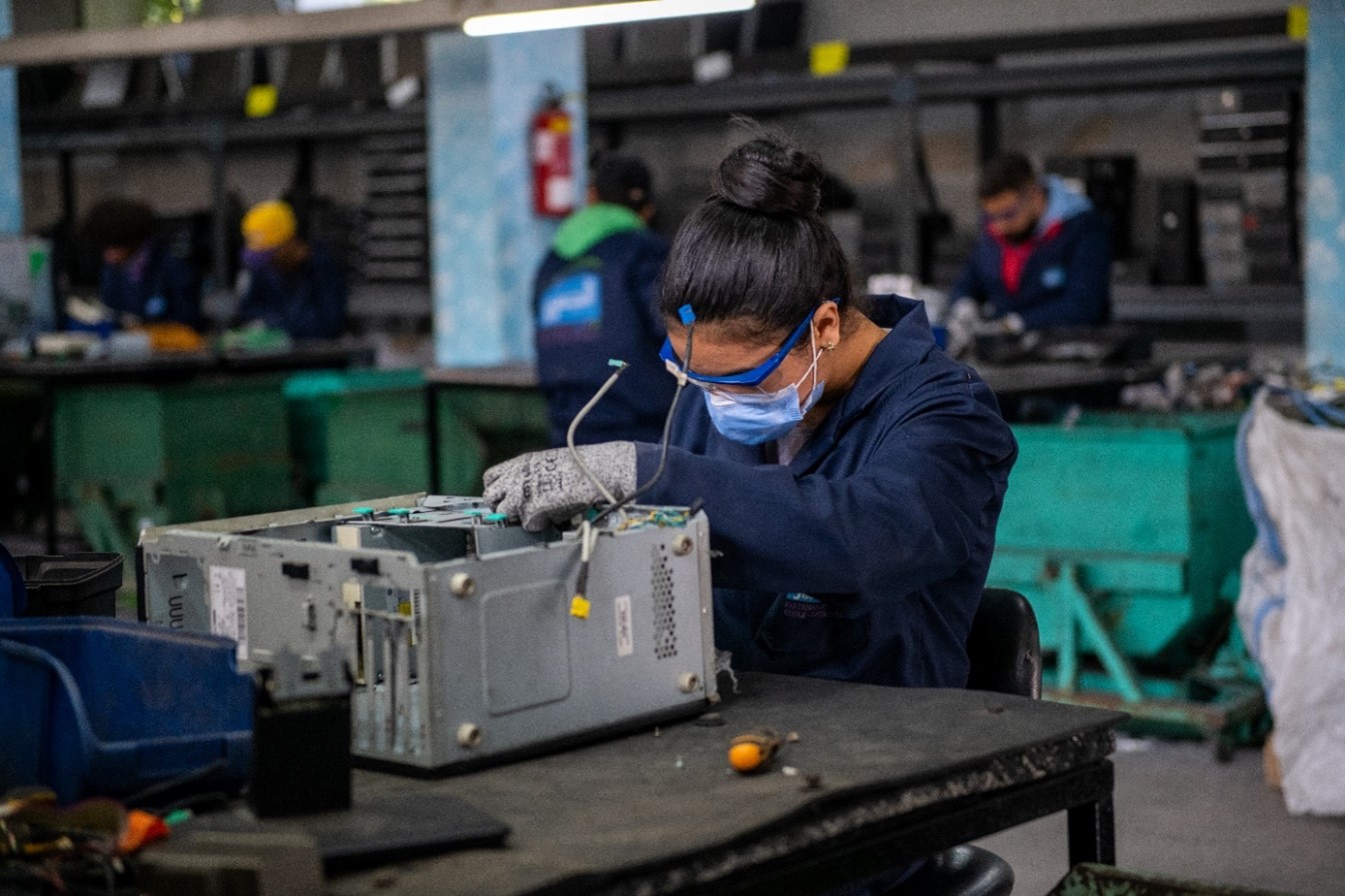 Trainee in Morocco maintains a computer during training.