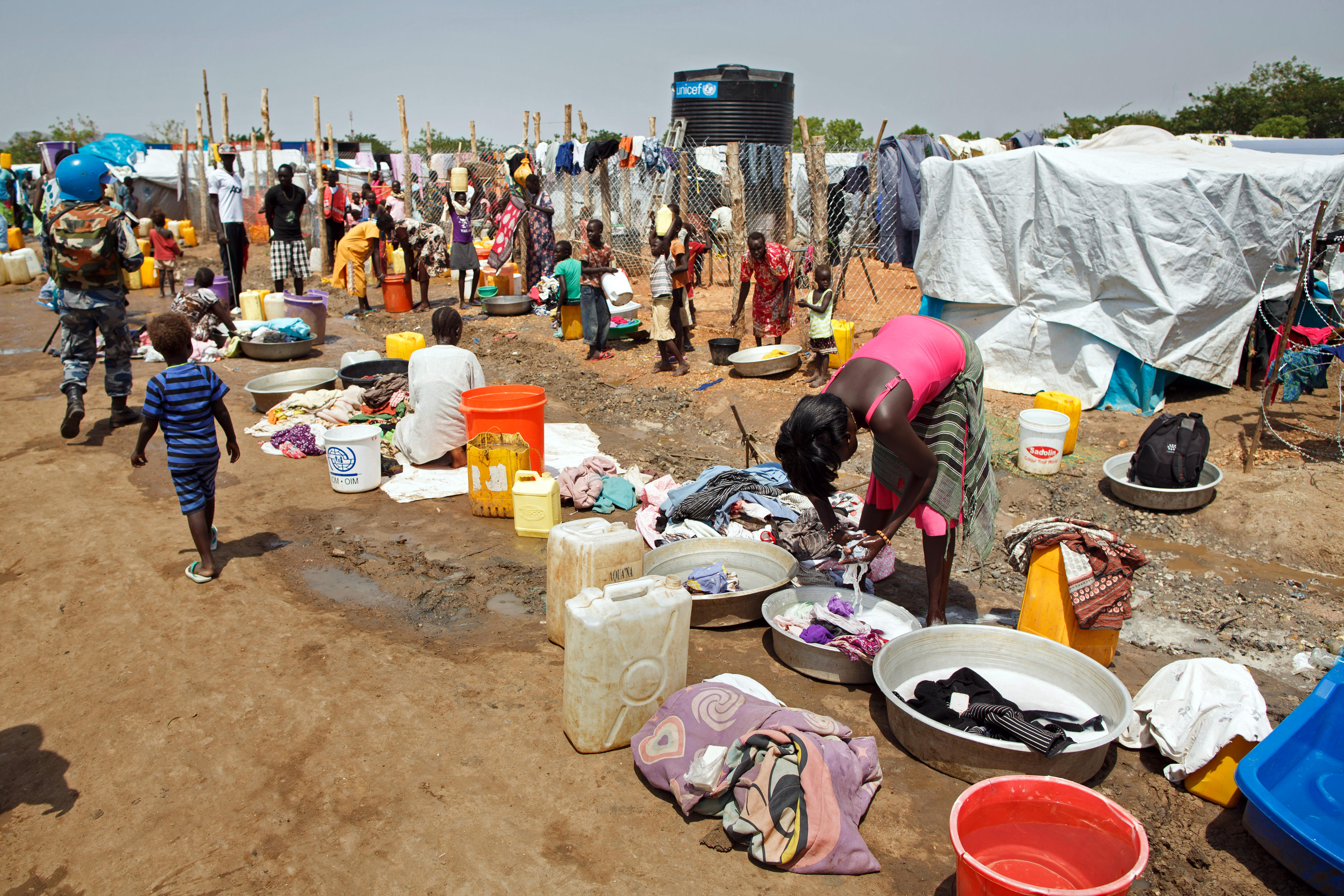 People wash their laundry in an internally displaced persons camp in the South Sudanese capital Juba